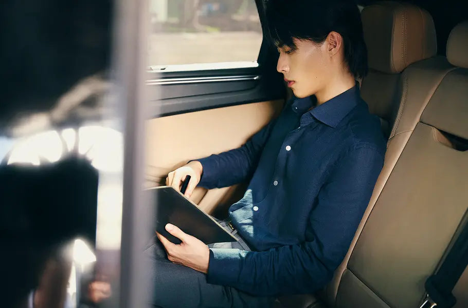 Man in a car wearing a Second Sons casual shirt